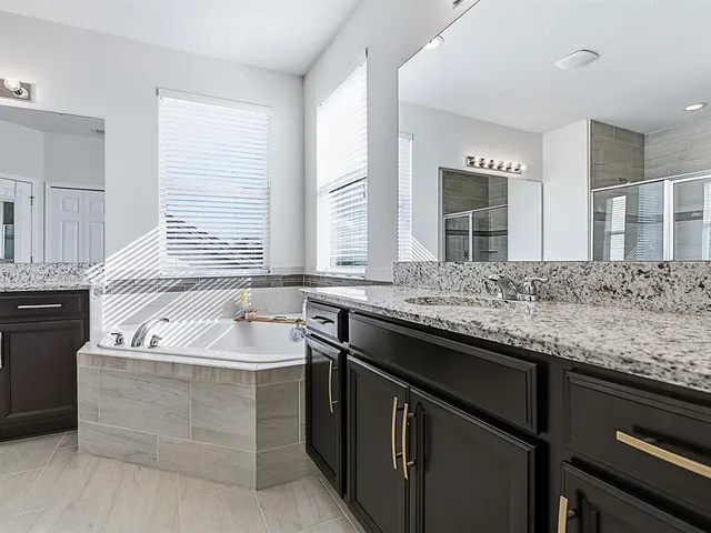 a view of a lake with a house in the background