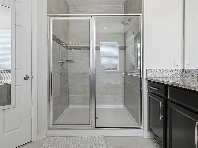 an aerial view of a residential houses with outdoor space