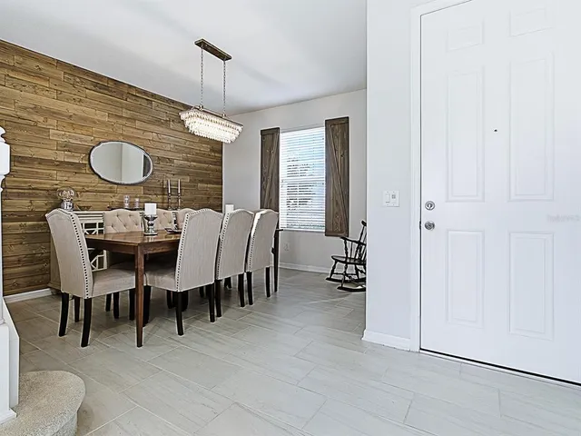 a dining room with furniture and window