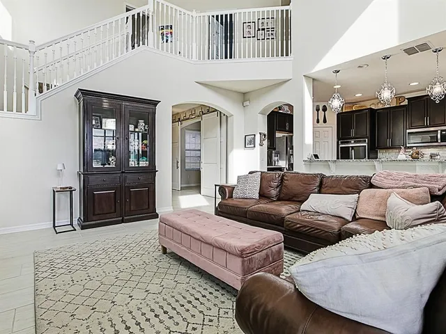 a modern kitchen with stainless steel appliances granite countertop a refrigerator and a stove