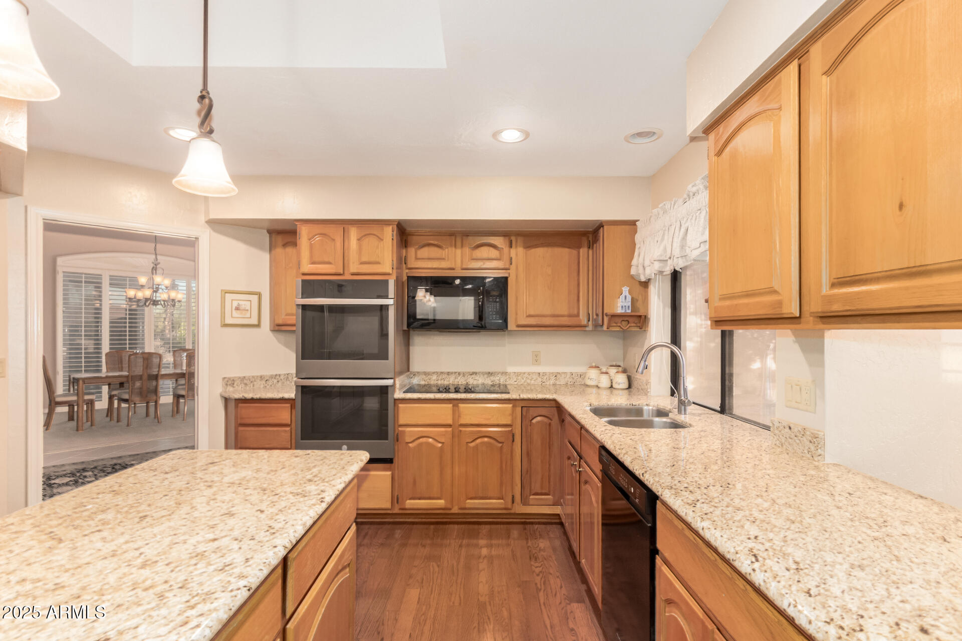 25628 Cordova Lane Rio Verde, AZ 85263 - Photo 12 of 35 a kitchen with stainless steel appliances granite countertop sink refrigerator and microwave