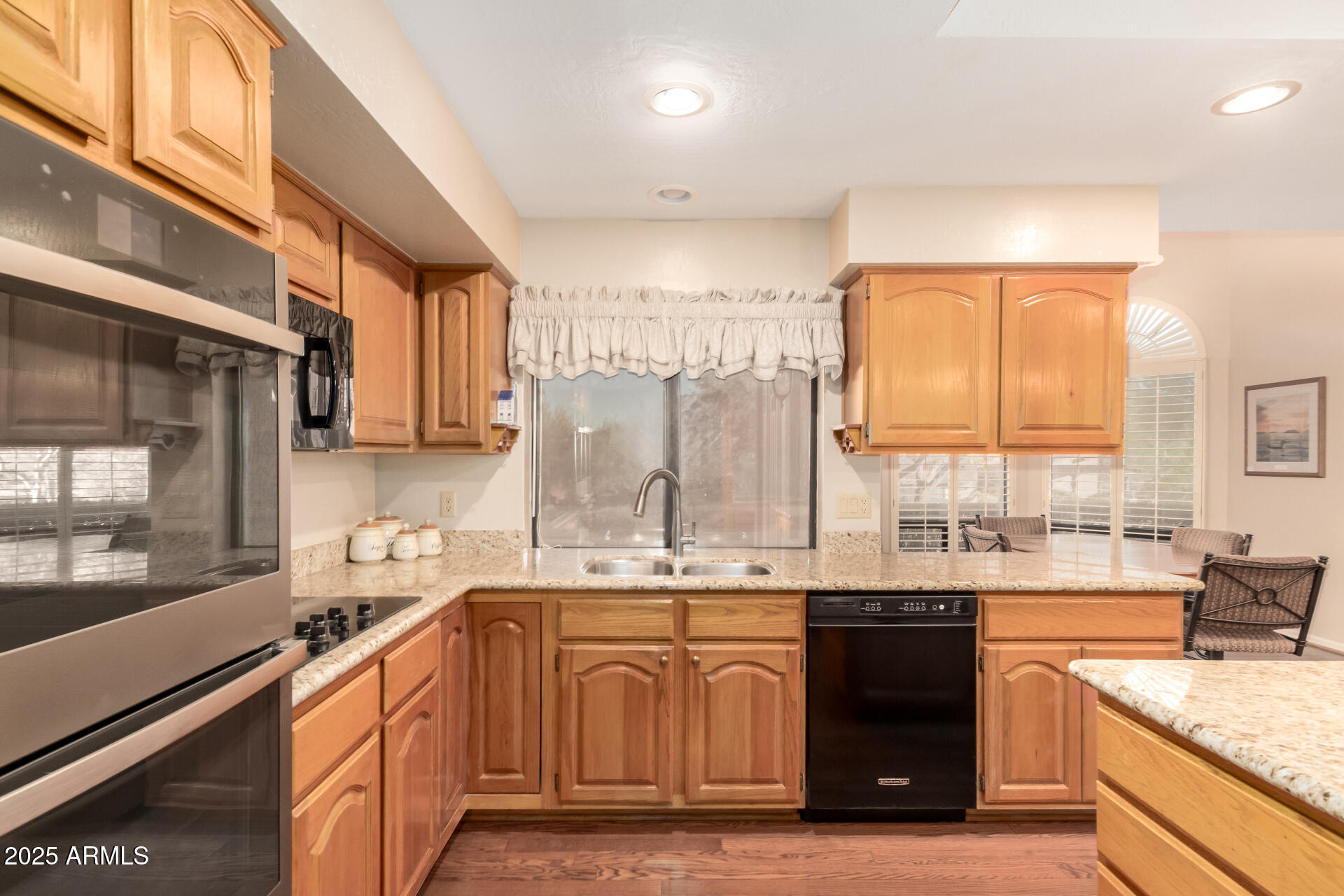 25628 Cordova Lane Rio Verde, AZ 85263 - Photo 13 of 35 a kitchen with stainless steel appliances granite countertop a sink a stove and a refrigerator