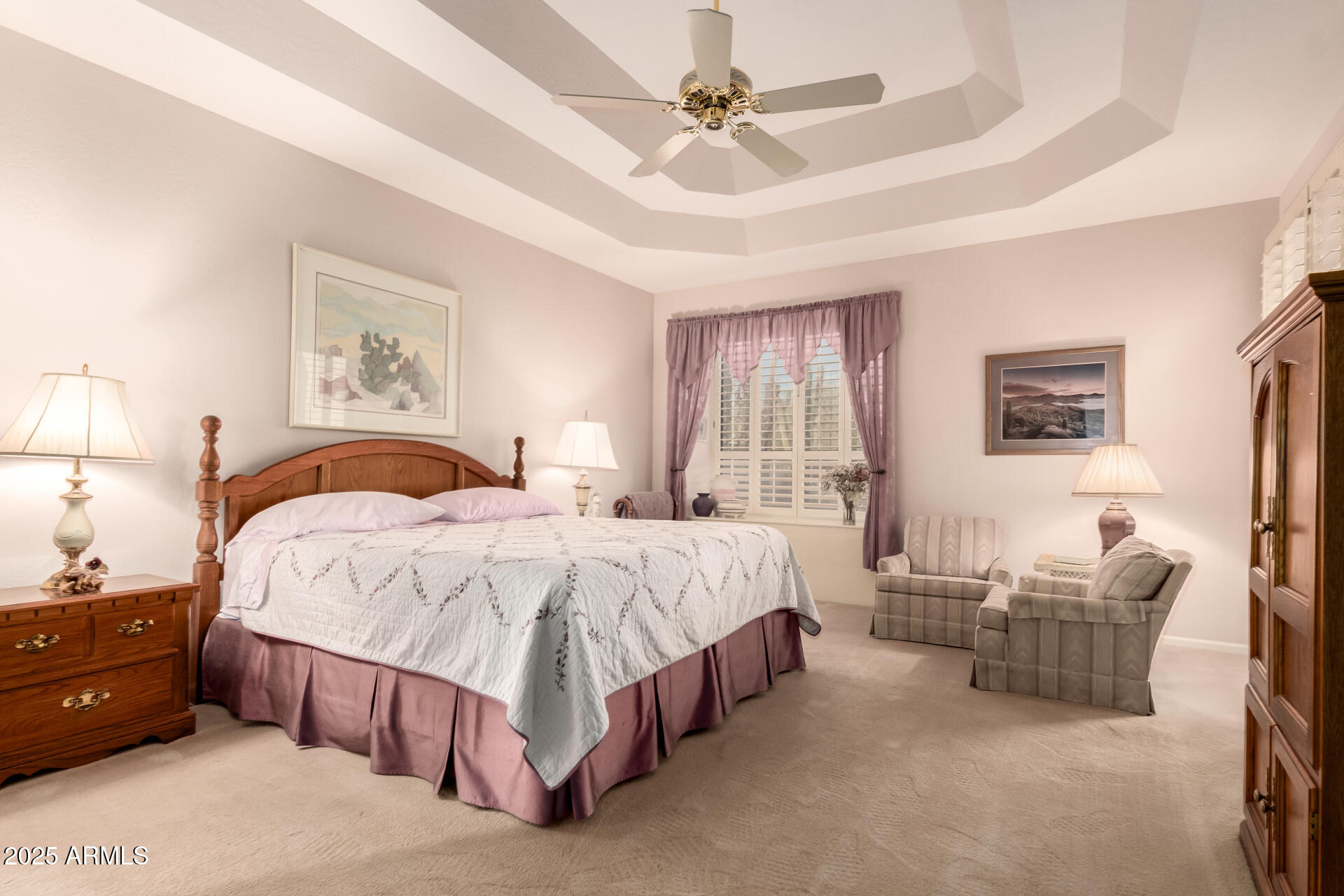 25628 Cordova Lane Rio Verde, AZ 85263 - Photo 20 of 35 a spacious bedroom with a bed a couch and a chandelier