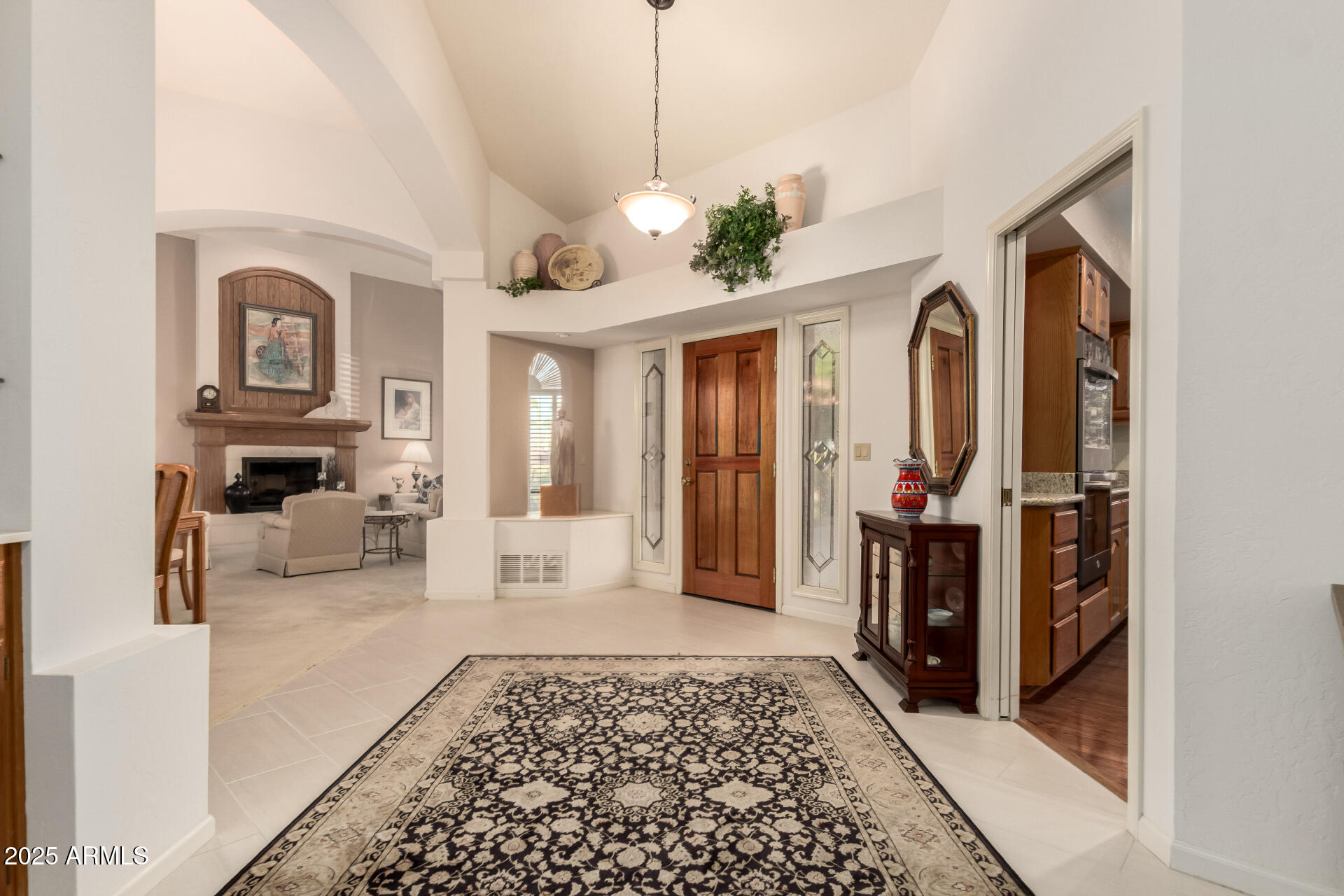 25628 Cordova Lane Rio Verde, AZ 85263 - Photo 5 of 35 a living room with furniture a rug and a chandelier