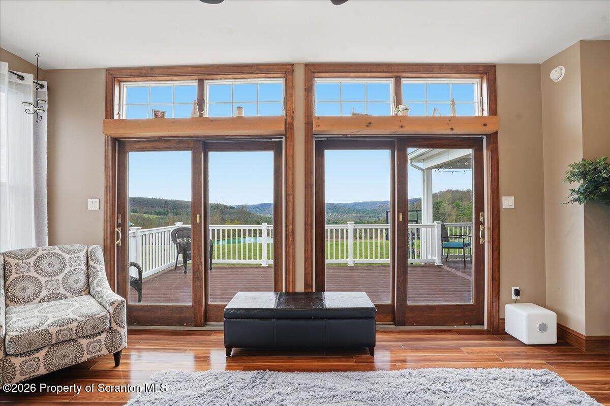 18 Bush Hill Road Great Bend, PA 18821 - Photo 21 of 125 a living room with furniture and a floor to ceiling window
