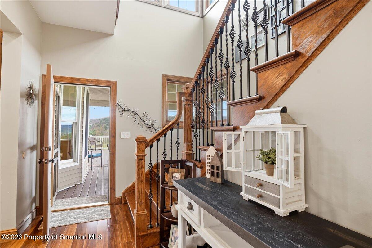 18 Bush Hill Road Great Bend, PA 18821 - Photo 39 of 125 a view of staircase with lots of frames on wall and wooden floor