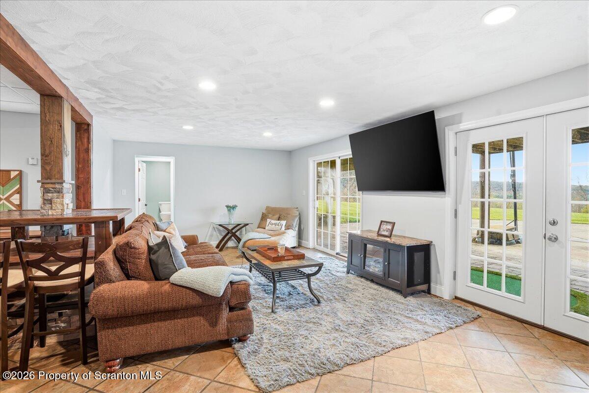 18 Bush Hill Road Great Bend, PA 18821 - Photo 51 of 125 a living room with furniture and a flat screen tv
