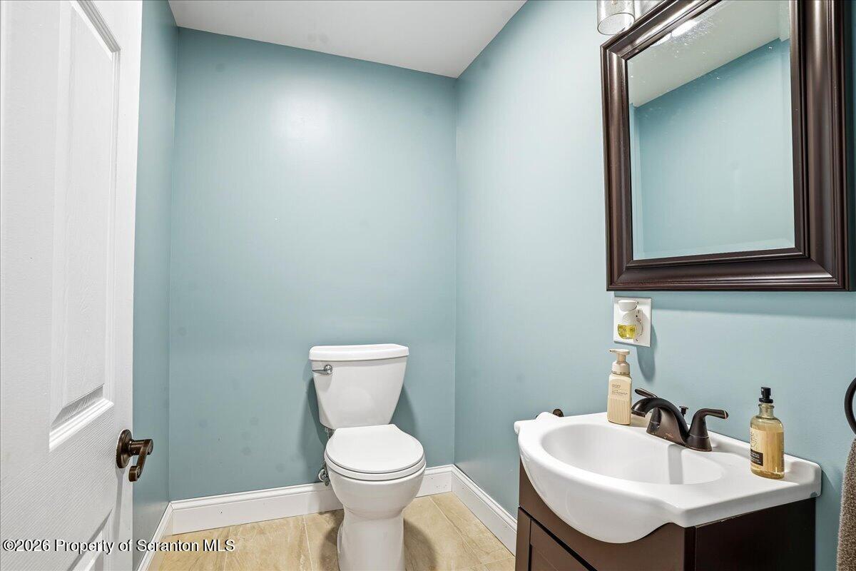 18 Bush Hill Road Great Bend, PA 18821 - Photo 58 of 125 a bathroom with a toilet a sink and mirror