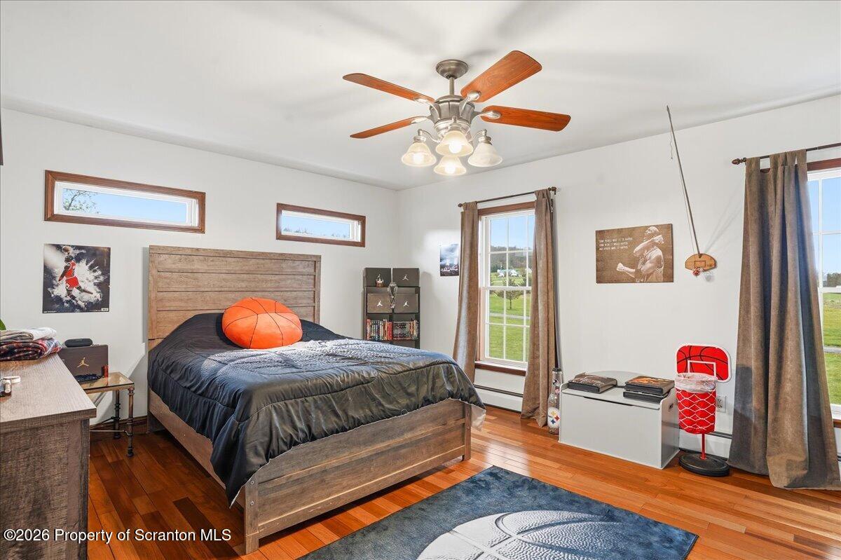 18 Bush Hill Road Great Bend, PA 18821 - Photo 82 of 125 a bedroom with a bed and a chandelier