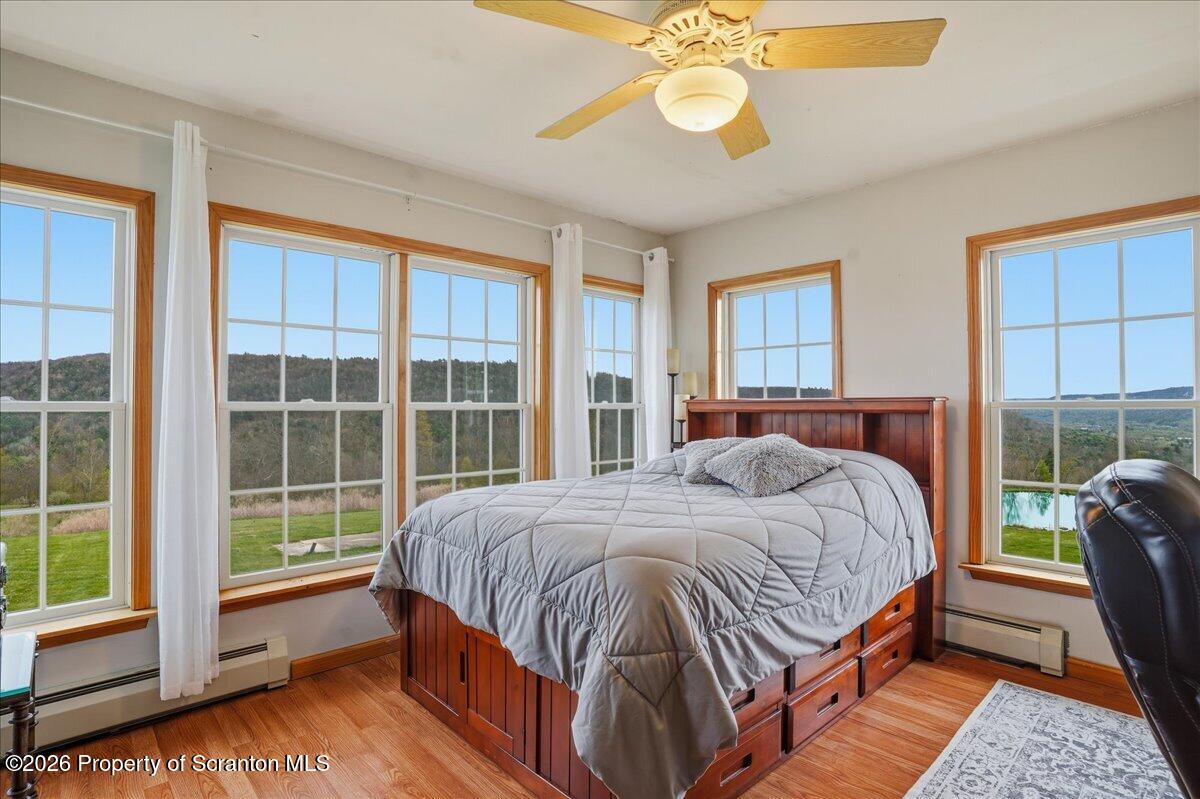 18 Bush Hill Road Great Bend, PA 18821 - Photo 95 of 125 a bedroom with a bed and a large window
