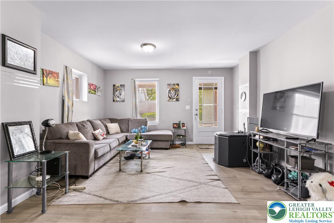 12 South Front Street Coplay, PA 18037 - Photo 6 of 41 This inviting living space features warm flooring, abundant natural light, and elegant recessed lighting.