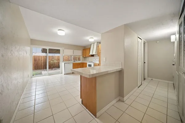 a kitchen with stainless steel appliances a stove sink and cabinets
