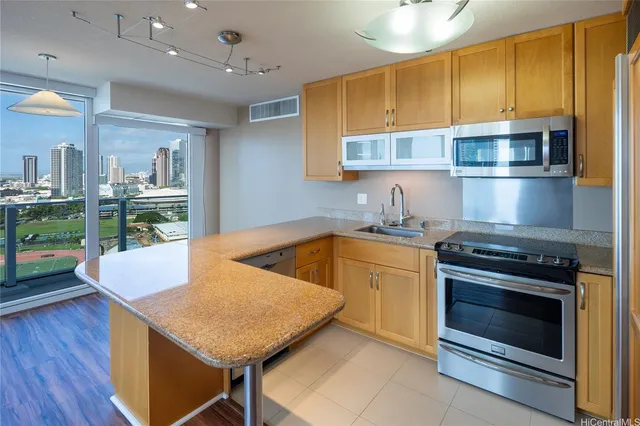 a kitchen with a stove a sink and a refrigerator