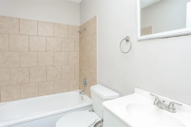 a bathroom with a toilet and a bathtub