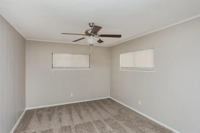 a view of a room with a sink cabinets and a window