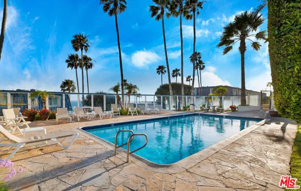 a view of a swimming pool with a sitting space