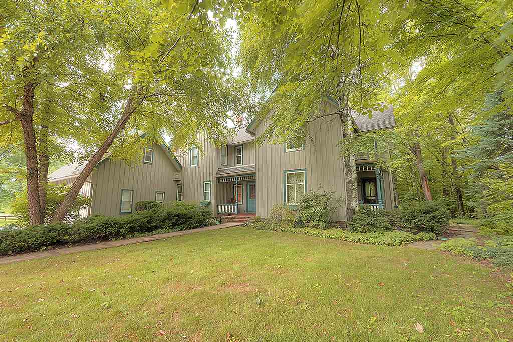 8395 Spring Brook Road Rockford, IL 61114 - Photo 1 of 24 a front view of house with yard and green space