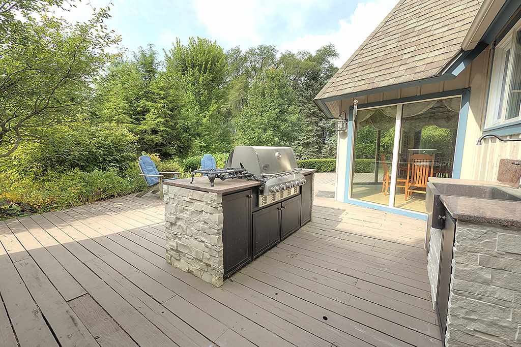 8395 Spring Brook Road Rockford, IL 61114 - Photo 18 of 24 a view of a deck and living room