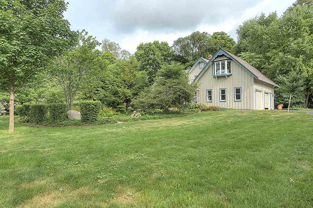 8395 Spring Brook Road Rockford, IL 61114 - Photo 20 of 24 a view of a house with a yard