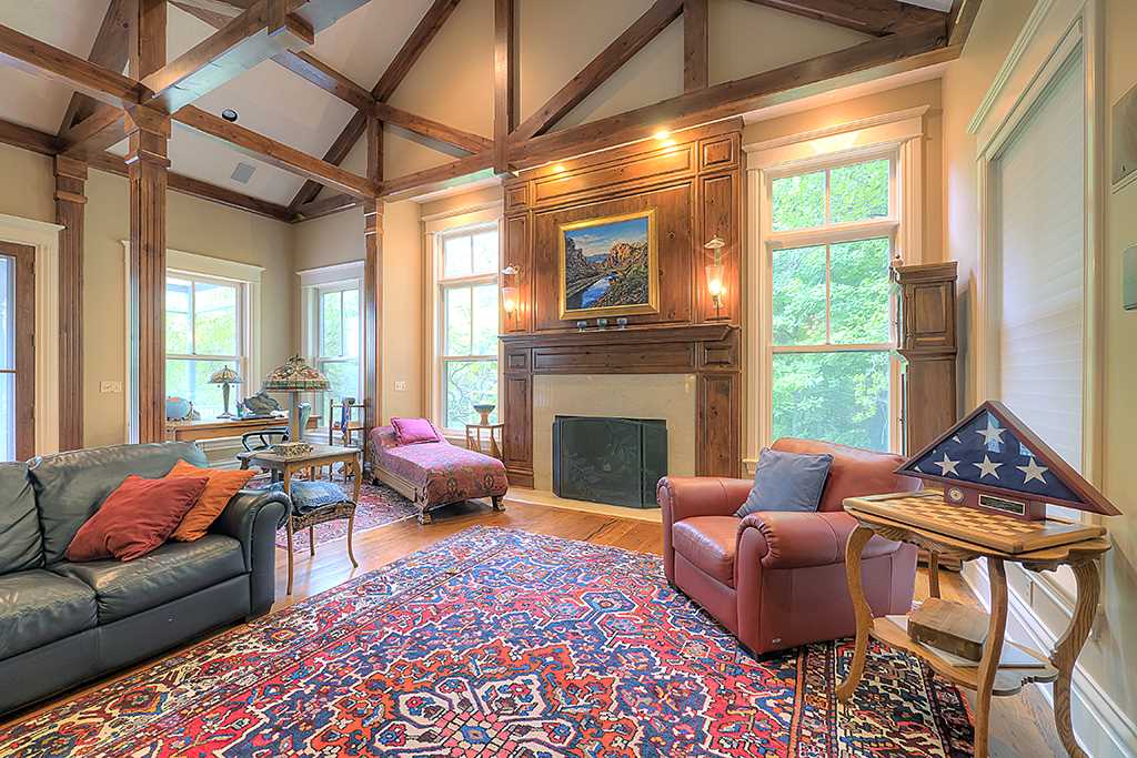 8395 Spring Brook Road Rockford, IL 61114 - Photo 4 of 24 a living room with furniture ceiling fan and a fireplace
