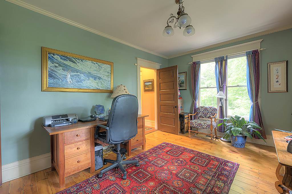 8395 Spring Brook Road Rockford, IL 61114 - Photo 6 of 24 a view of a workspace with furniture and a window