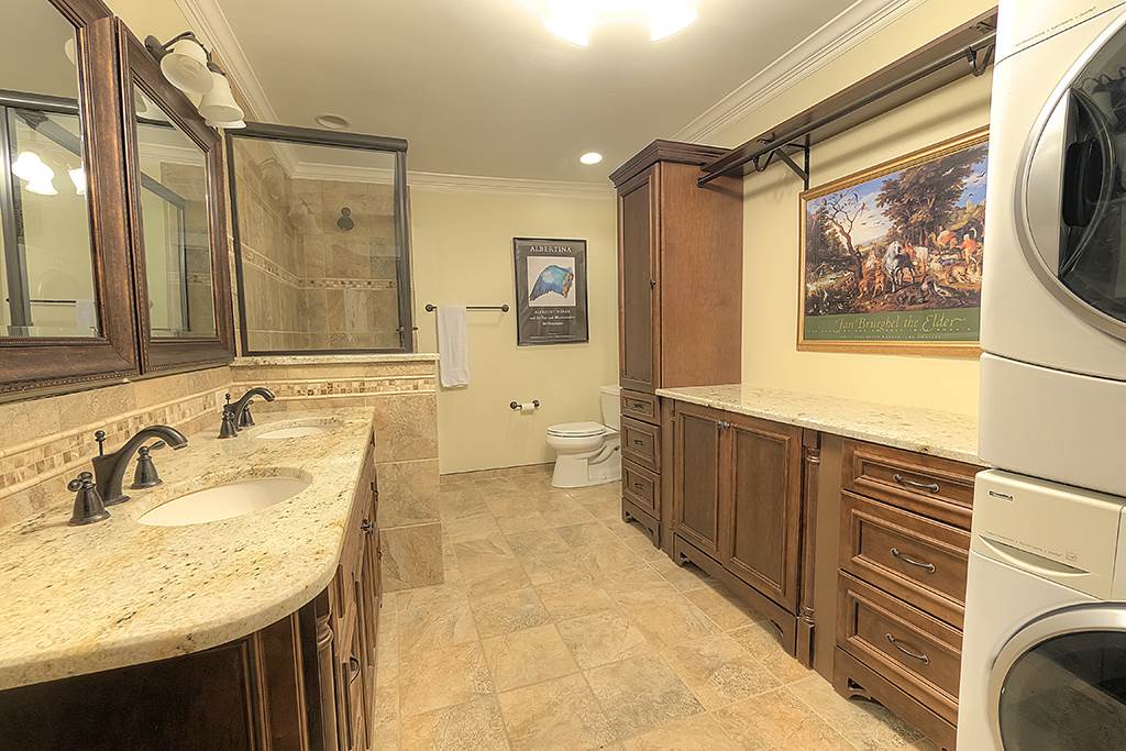 8395 Spring Brook Road Rockford, IL 61114 - Photo 7 of 24 a bathroom with a sink a vanity and a mirror
