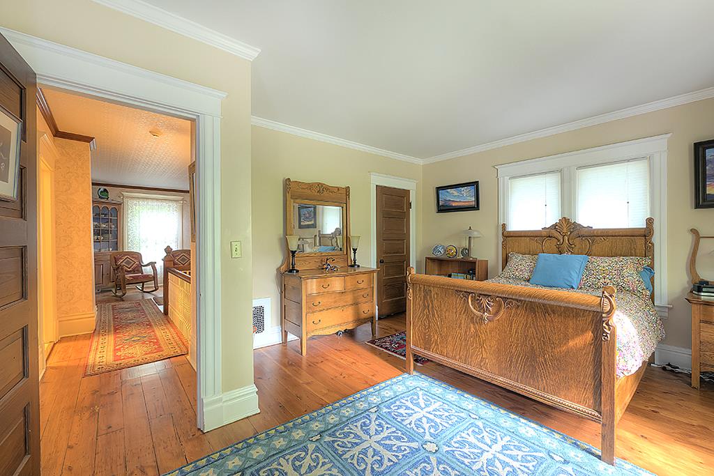 8395 Spring Brook Road Rockford, IL 61114 - Photo 8 of 24 a living room with furniture and a wooden floor