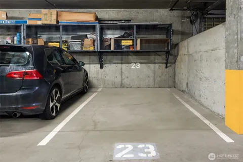 a view of parking garage with cars