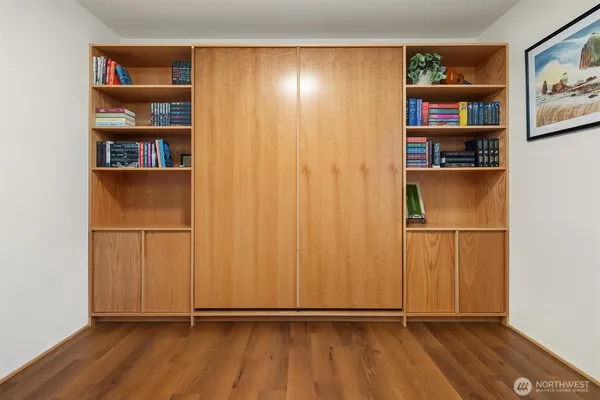 a view of an empty room with shelves