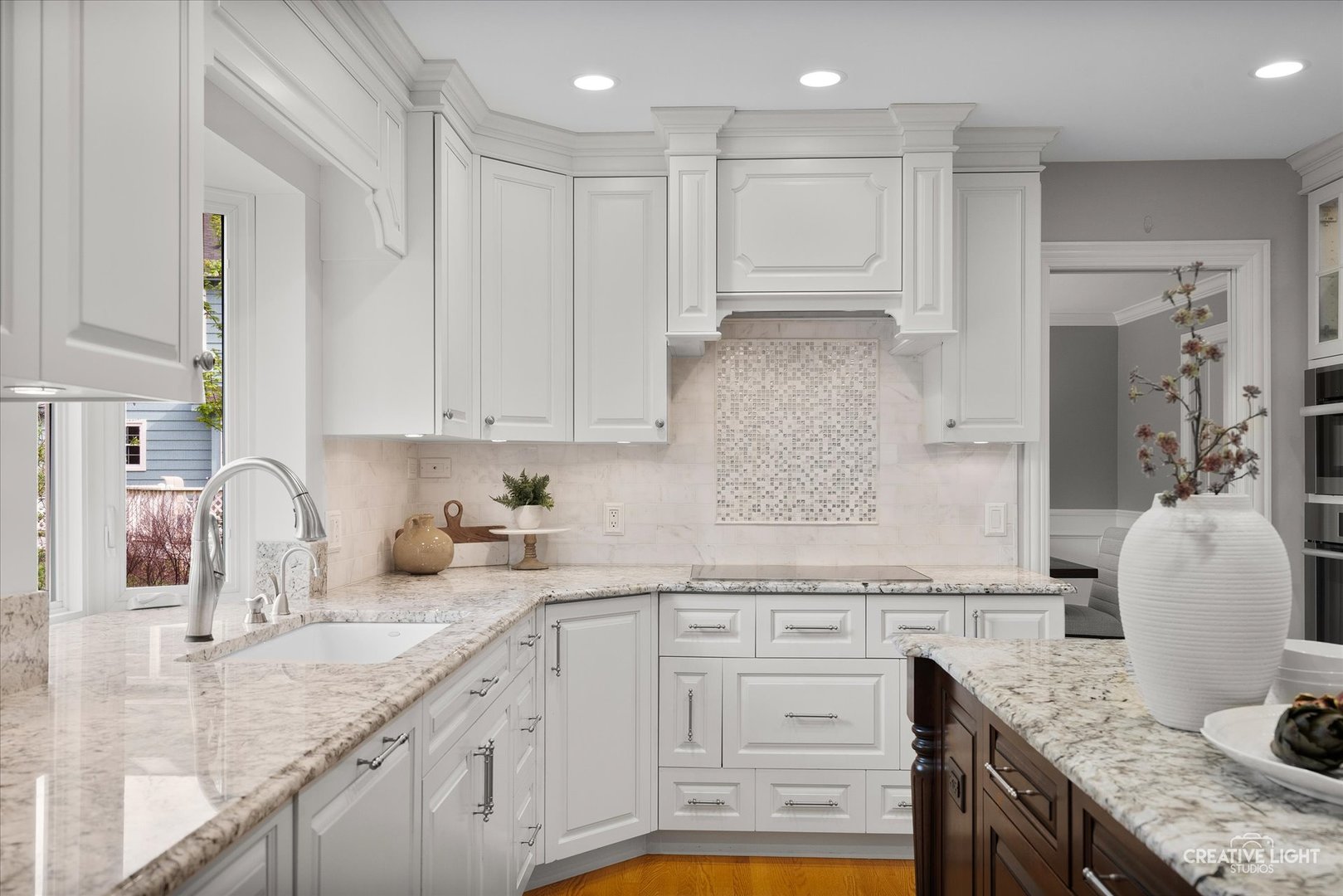 1454 Rill Court Naperville, IL 60565 - Photo 13 of 58 a kitchen with granite countertop white cabinets and white appliances