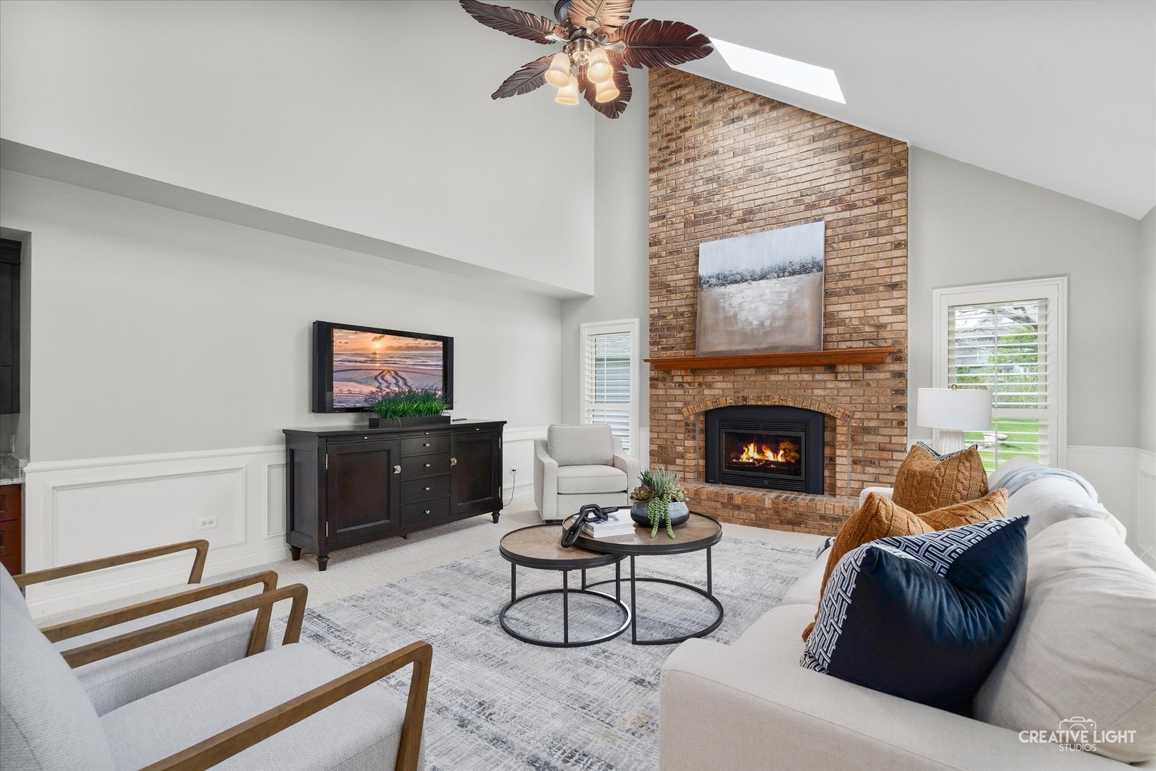 1454 Rill Court Naperville, IL 60565 - Photo 20 of 58 a living room with furniture a fireplace and a flat screen tv