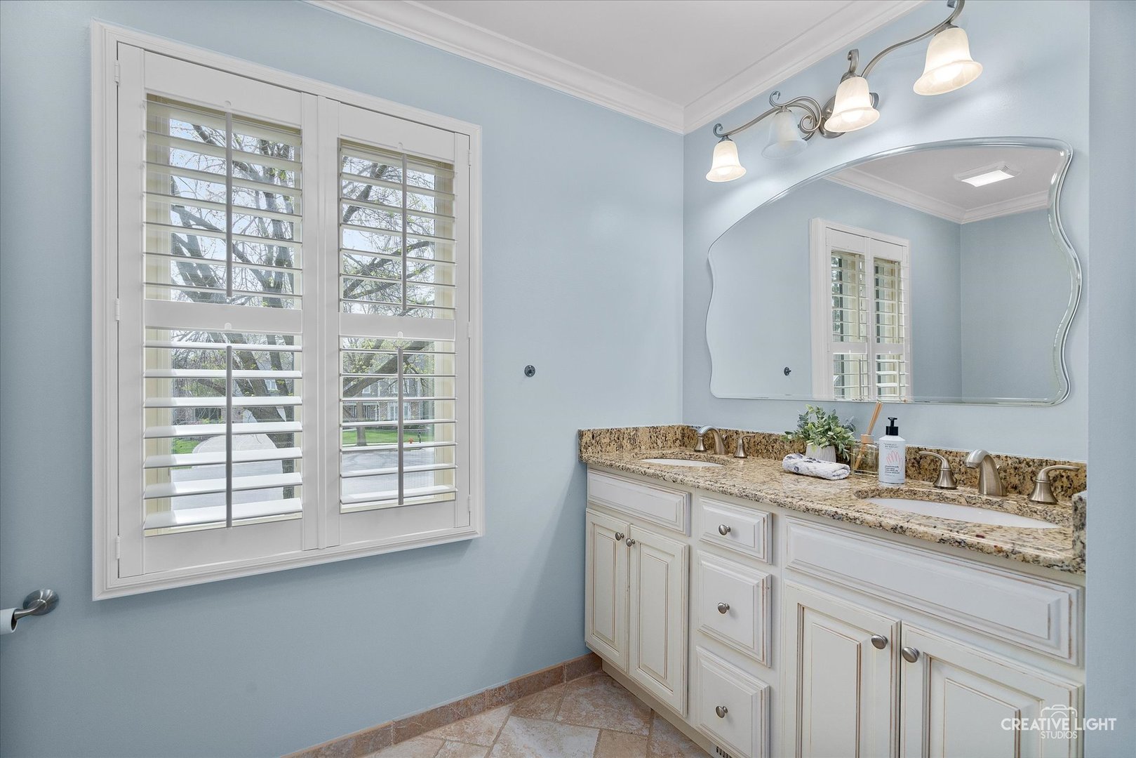 1454 Rill Court Naperville, IL 60565 - Photo 33 of 58 a bathroom with double sink large mirror and a window