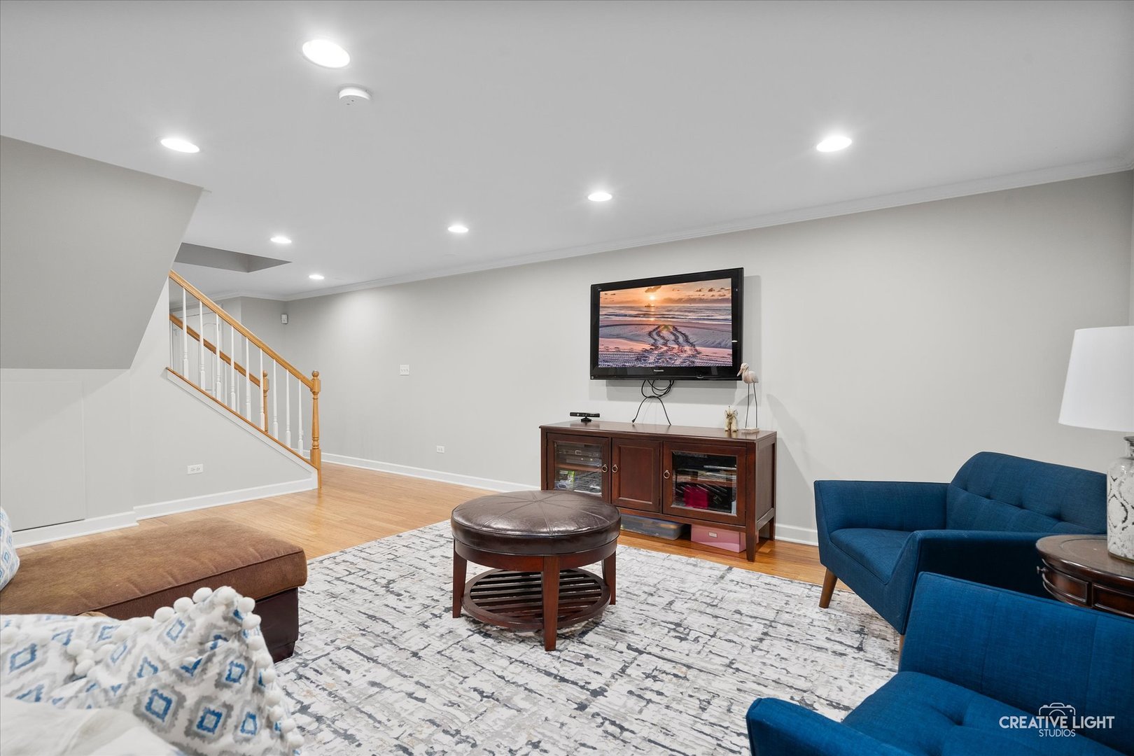 1454 Rill Court Naperville, IL 60565 - Photo 36 of 58 a living room with furniture and a fireplace