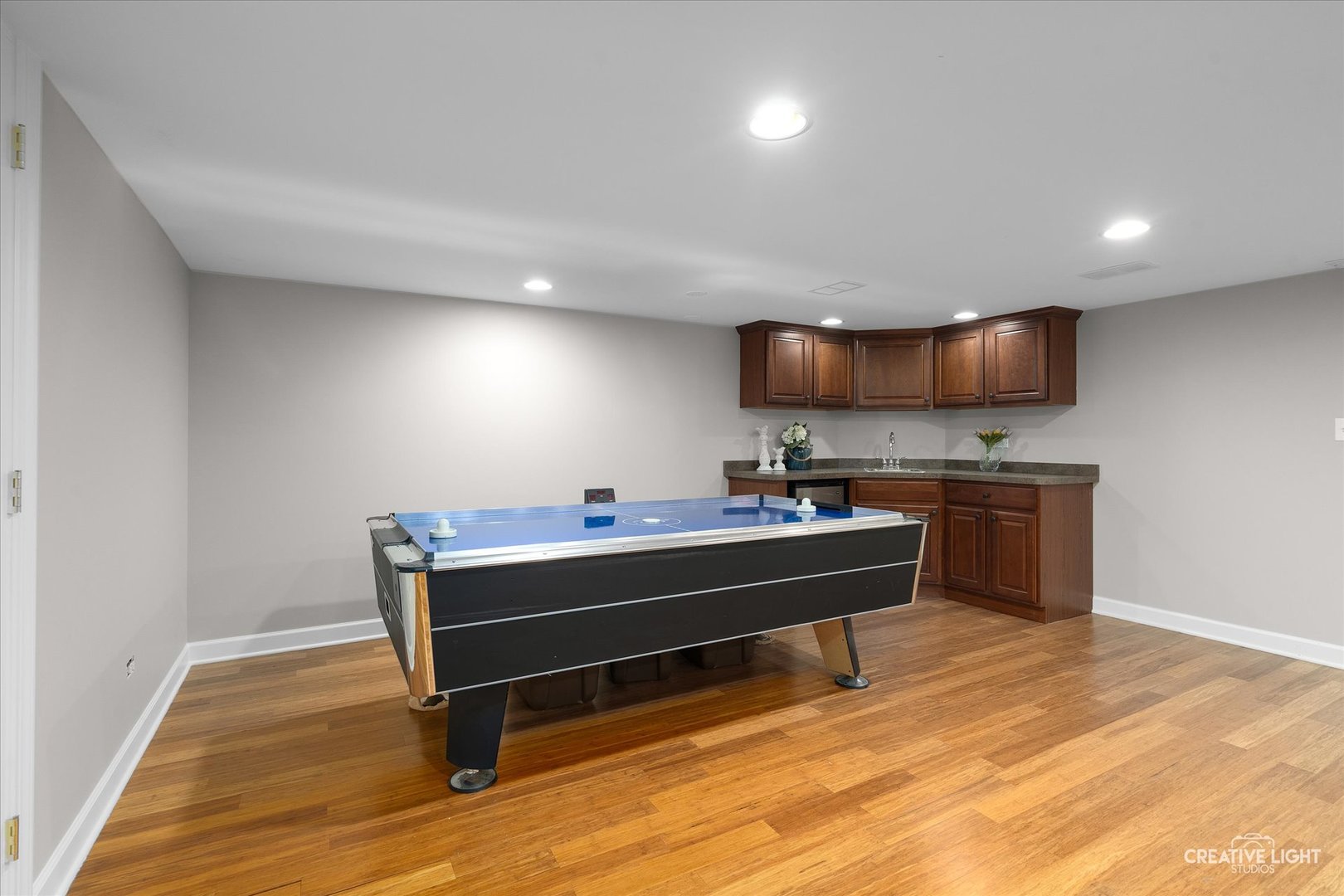 1454 Rill Court Naperville, IL 60565 - Photo 38 of 58 a view of kitchen with furniture and wooden floor