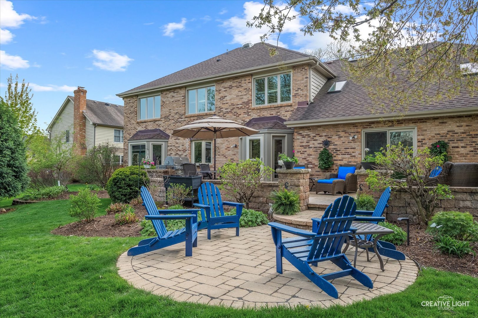 1454 Rill Court Naperville, IL 60565 - Photo 43 of 58 a view of a house with backyard sitting area and garden