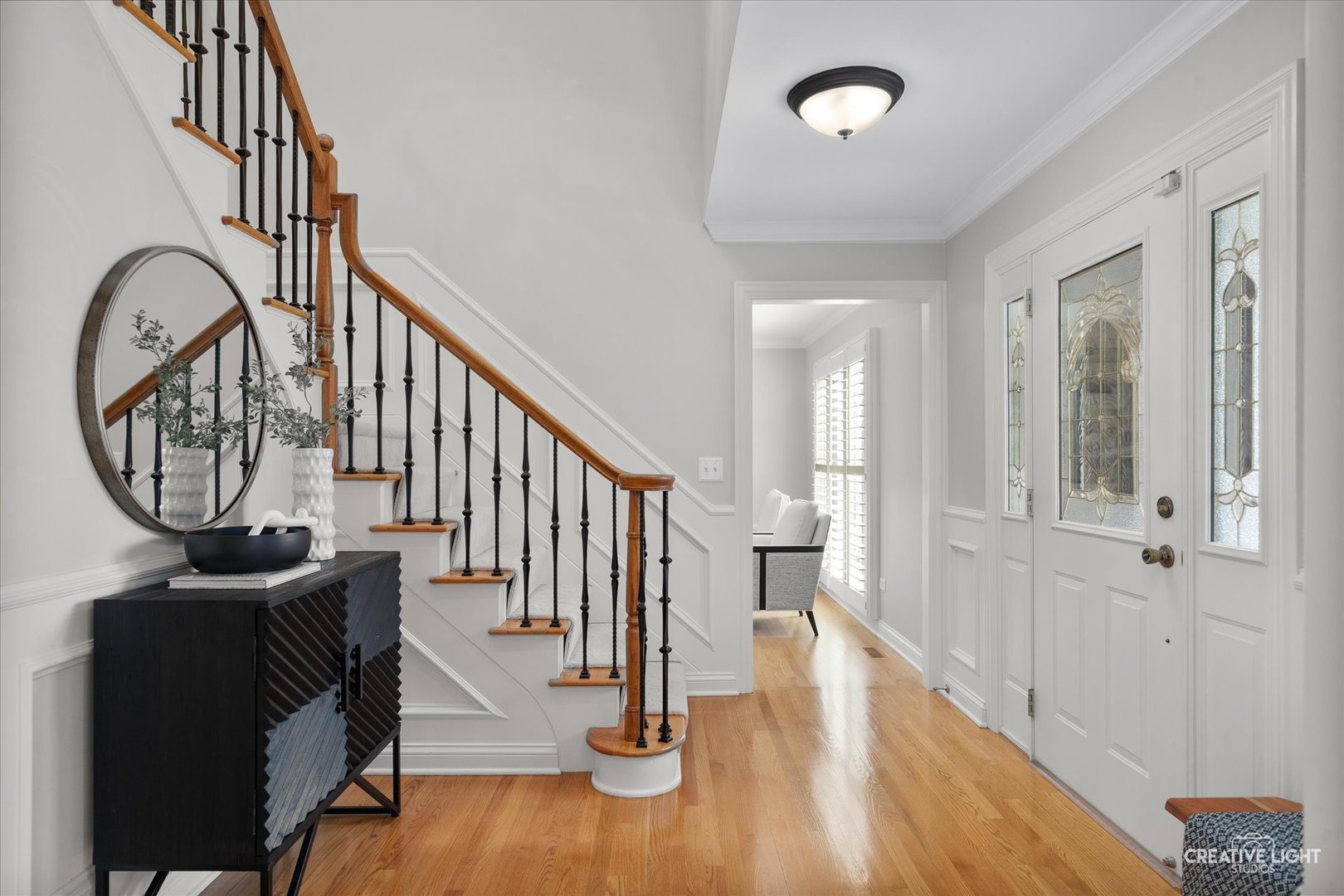 1454 Rill Court Naperville, IL 60565 - Photo 6 of 58 a view of an entryway with wooden floor and door