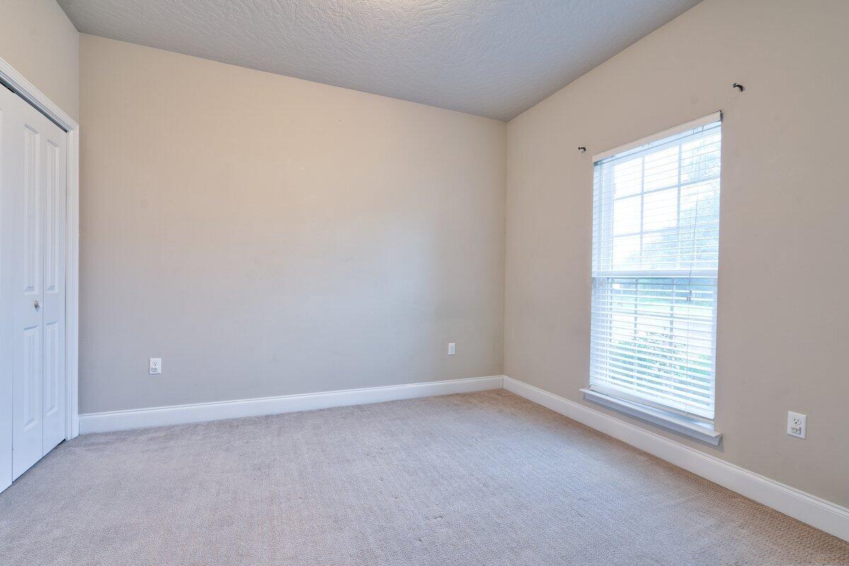 4614 Hermosa Road Crestview, FL 32539 - Photo 17 of 23 a view of an empty room with a window