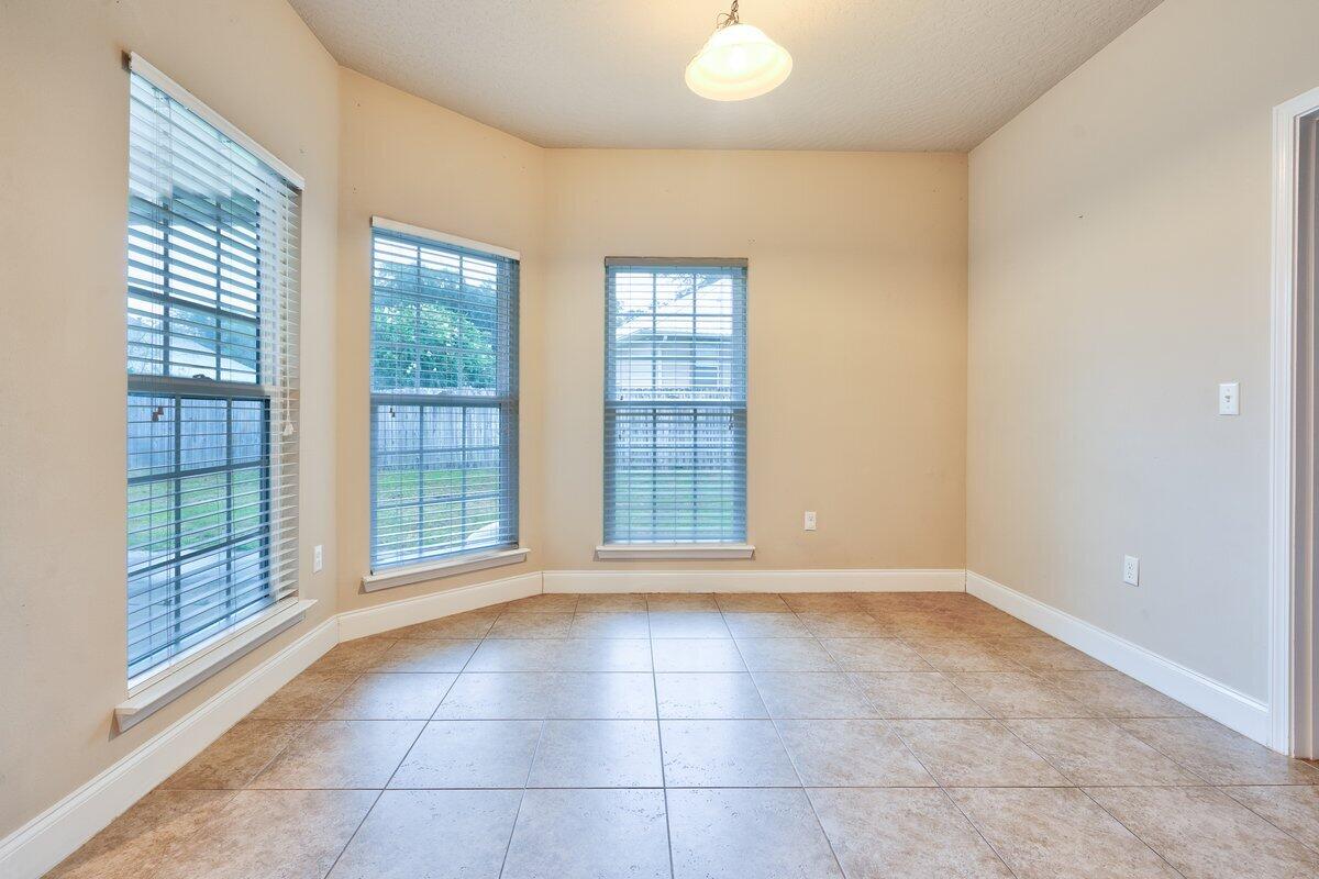 4614 Hermosa Road Crestview, FL 32539 - Photo 10 of 23 a view of an empty room with glass door