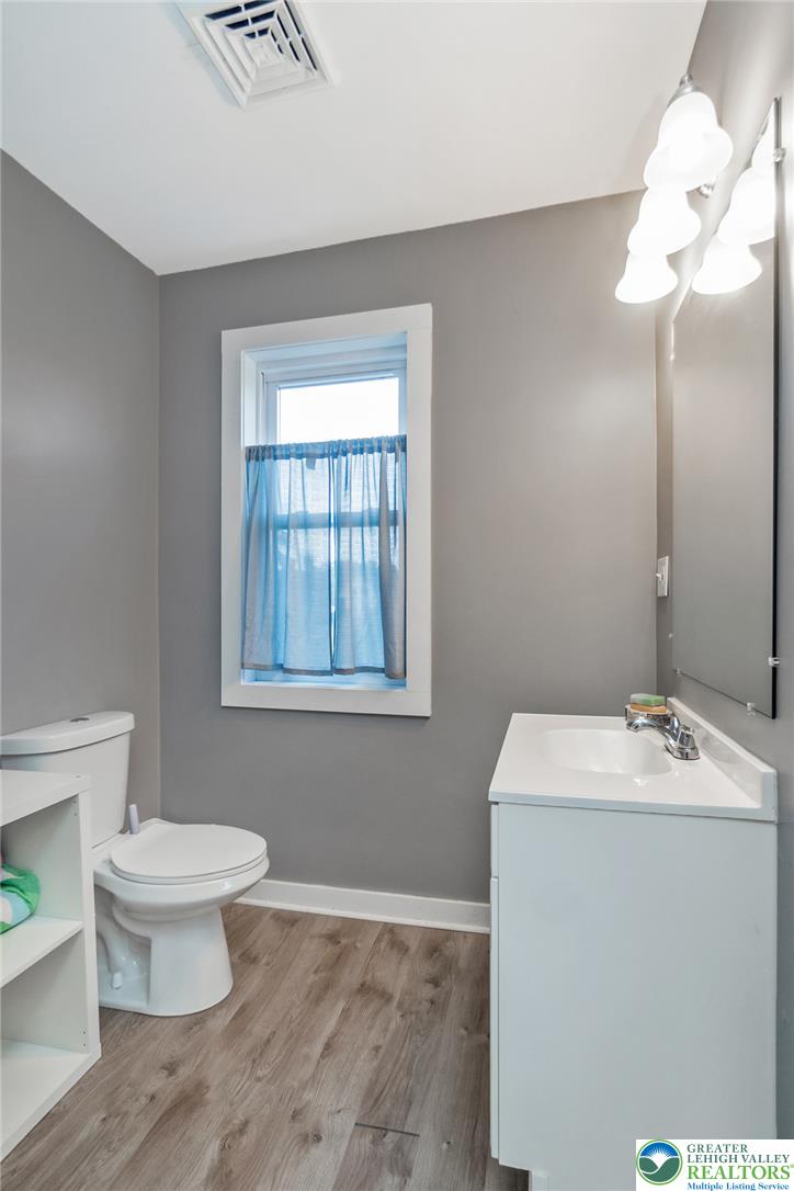 506 Richmond Road Bangor, PA 18013 - Photo 25 of 43 A single window provides natural illumination inside this updated bathroom with wood-look flooring.