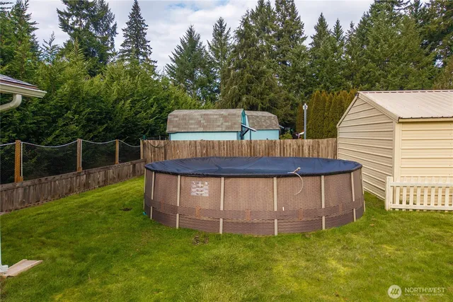 a view of front of house with a yard