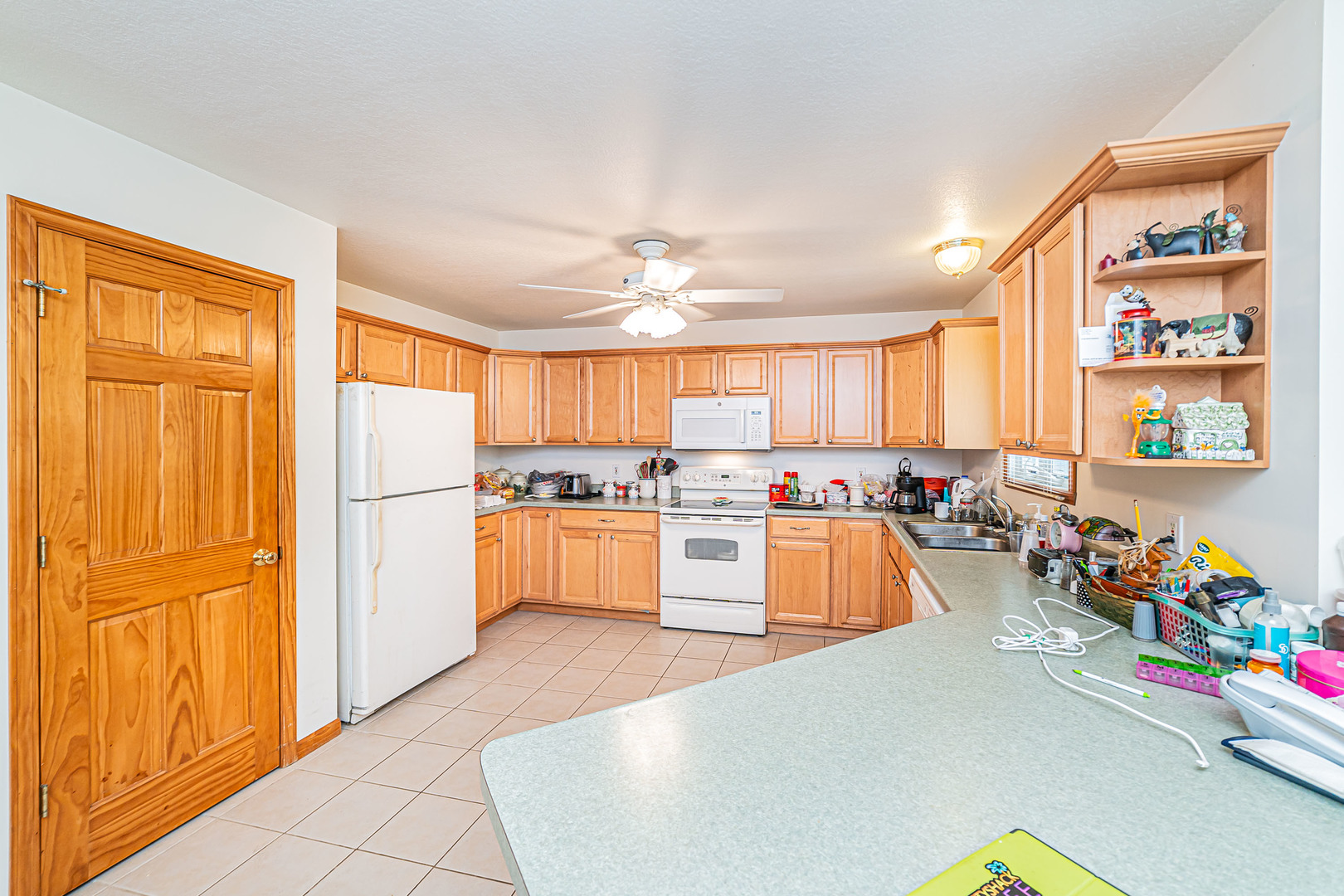2113 Grand Detour Road Dixon, IL 61021 - Photo 11 of 35 a kitchen with a refrigerator and a stove top oven
