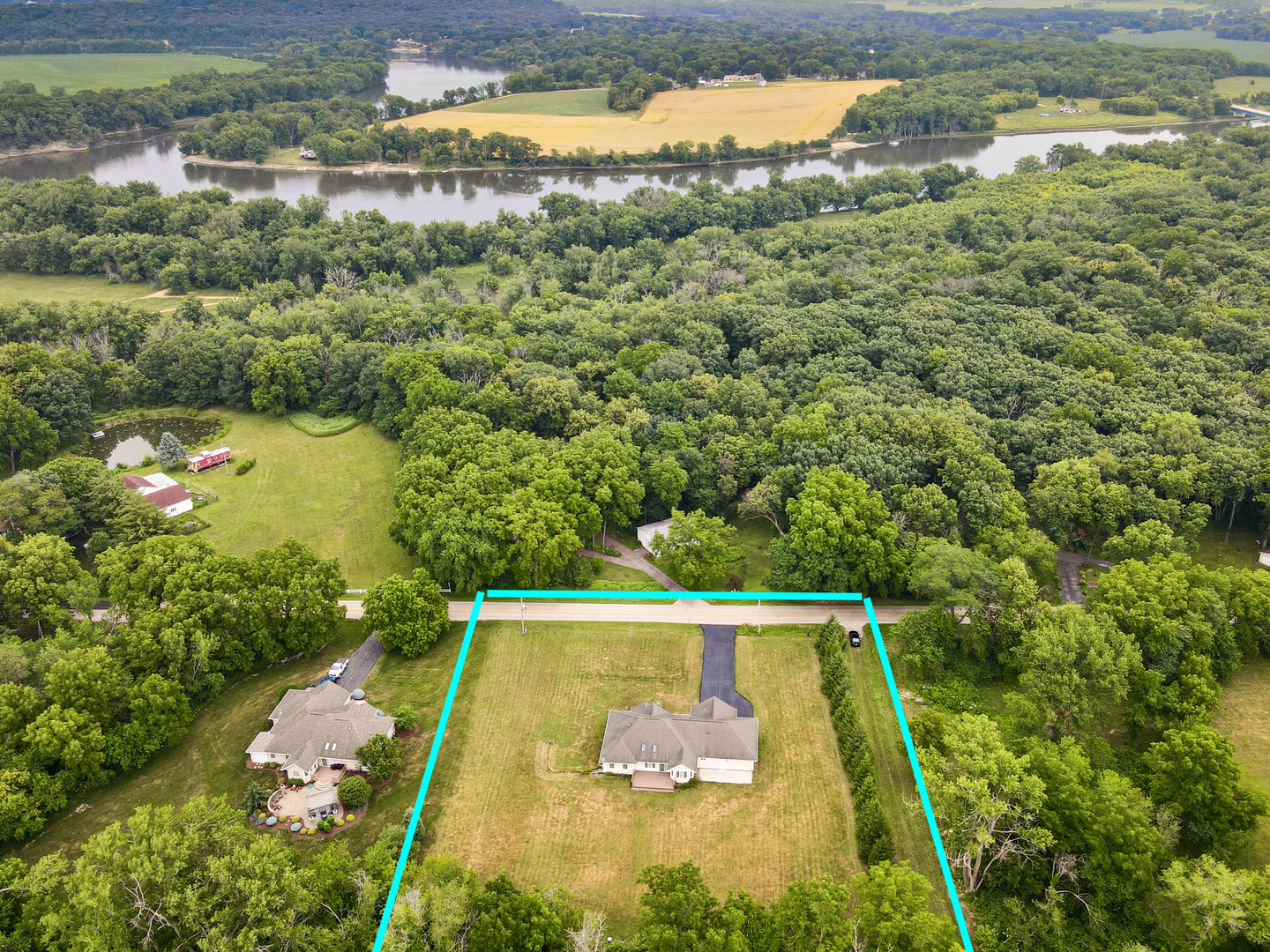 2113 Grand Detour Road Dixon, IL 61021 - Photo 2 of 35 a view of a yard with a lake