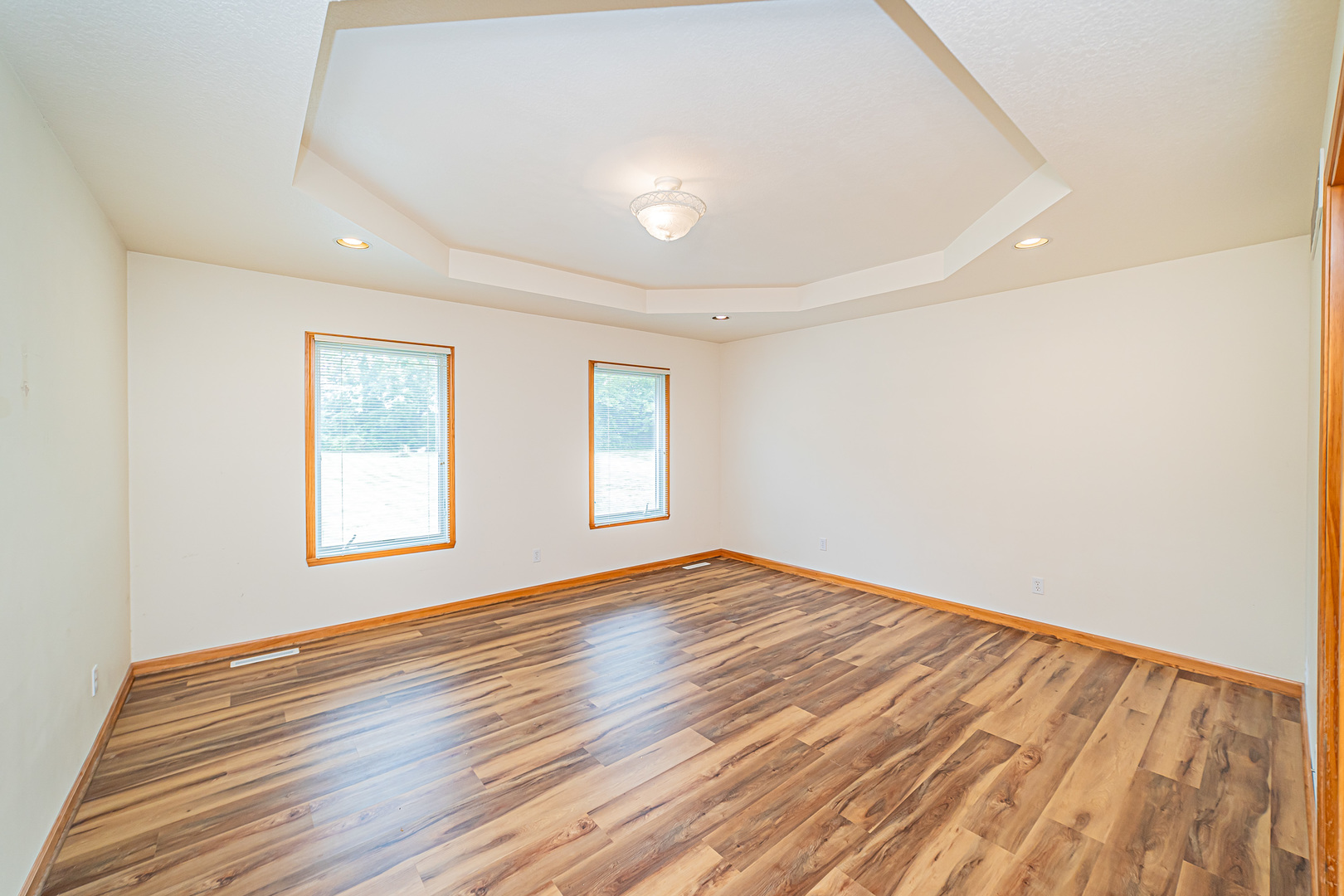 2113 Grand Detour Road Dixon, IL 61021 - Photo 6 of 35 a view of an empty room with wooden floor and a window