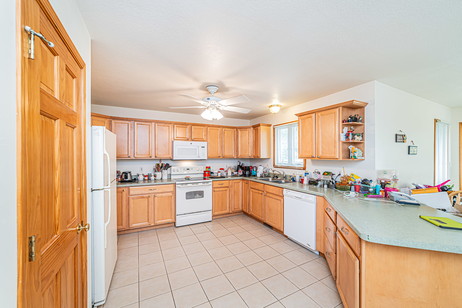 2113 Grand Detour Road Dixon, IL 61021 - Photo 10 of 35 a kitchen with a sink stove and cabinets
