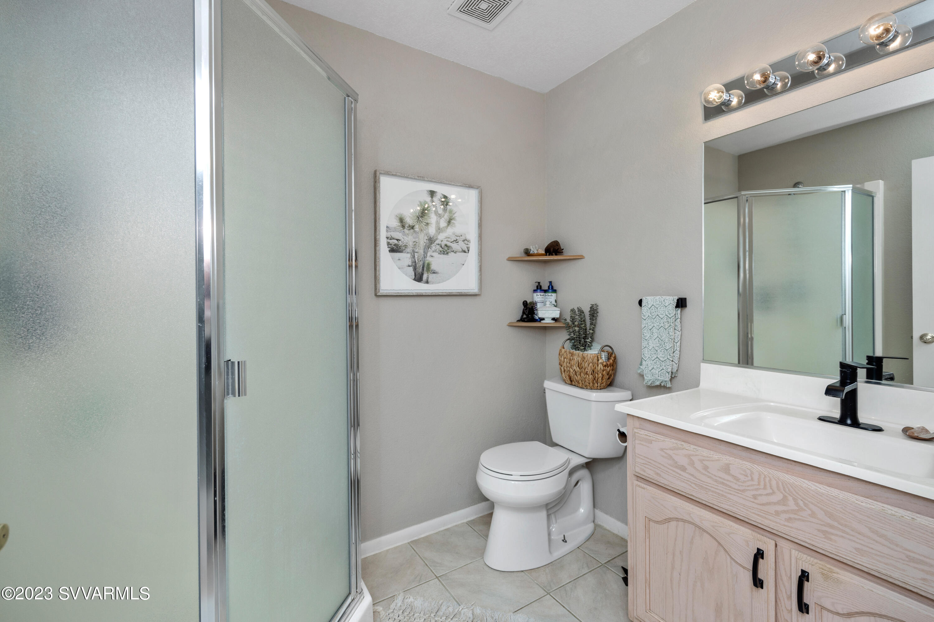 4270 Maya Way Rimrock, AZ 86335 - Photo 17 of 32 a bathroom with a toilet sink and mirror