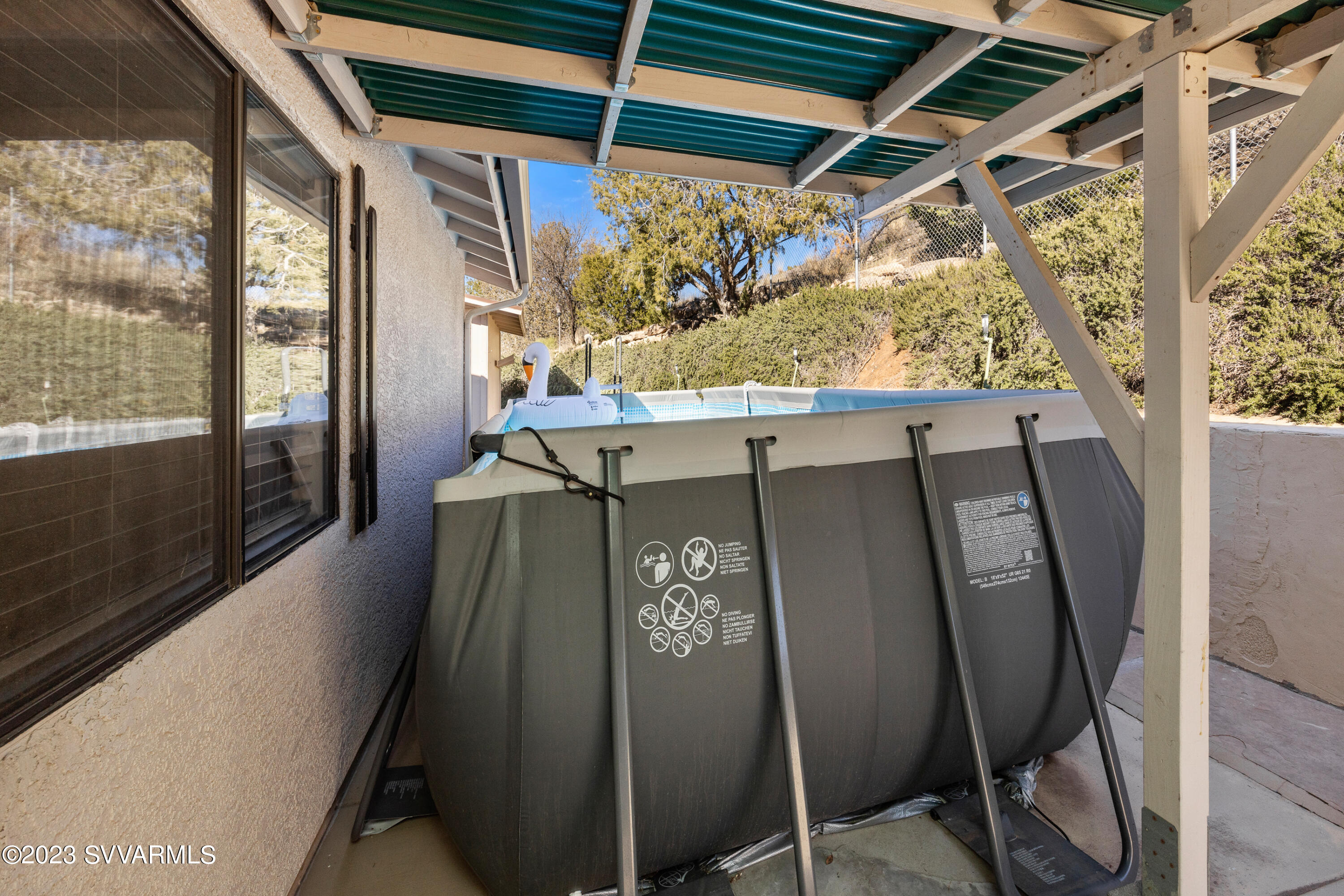 4270 Maya Way Rimrock, AZ 86335 - Photo 20 of 32 a view of a door and chair in the balcony