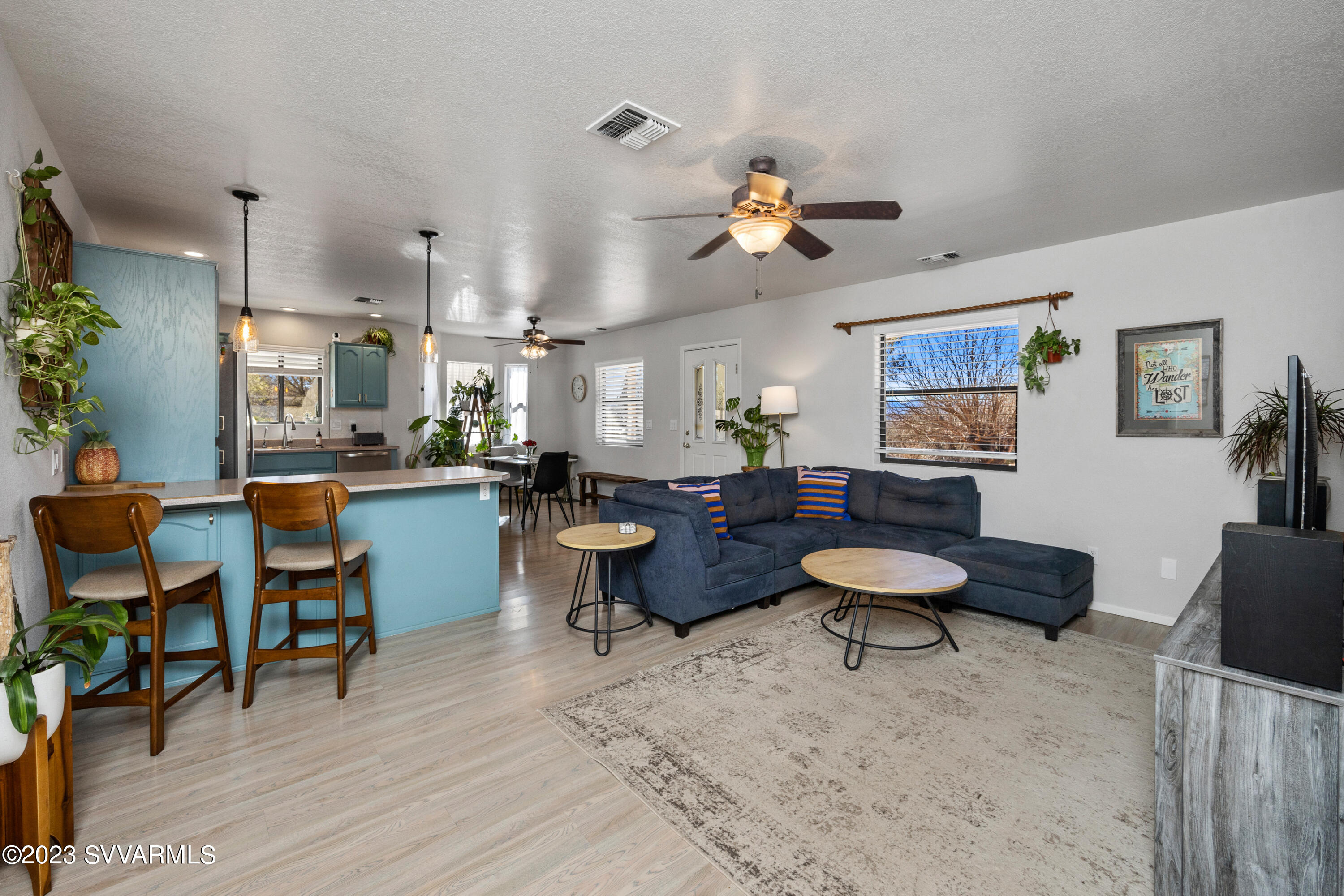 4270 Maya Way Rimrock, AZ 86335 - Photo 9 of 32 a living room with furniture kitchen view and a wooden floor
