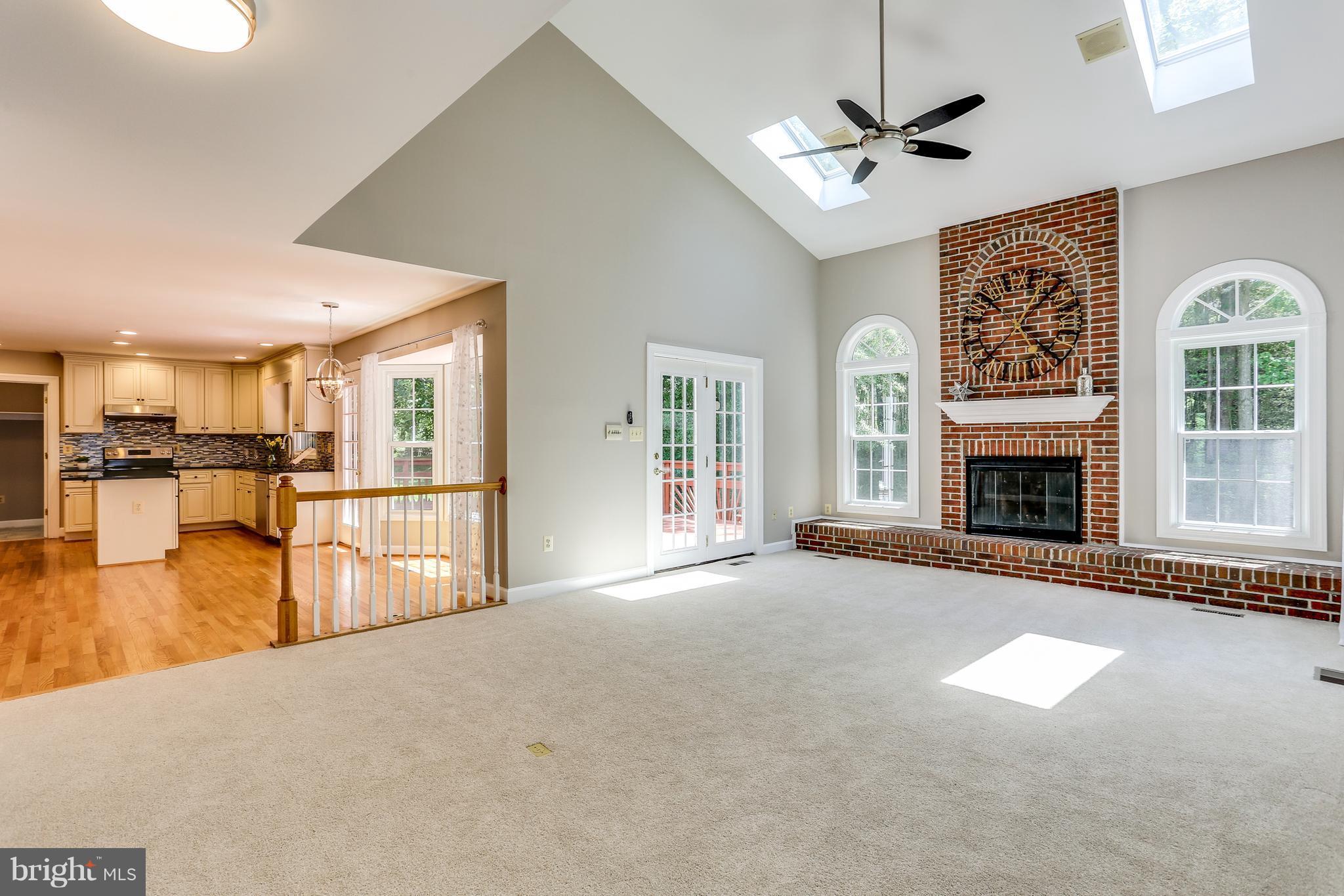 8394 Autumn Rust Road Ellicott City, MD 21043 - Photo 11 of 30 Family Room with high ceilings and French doors