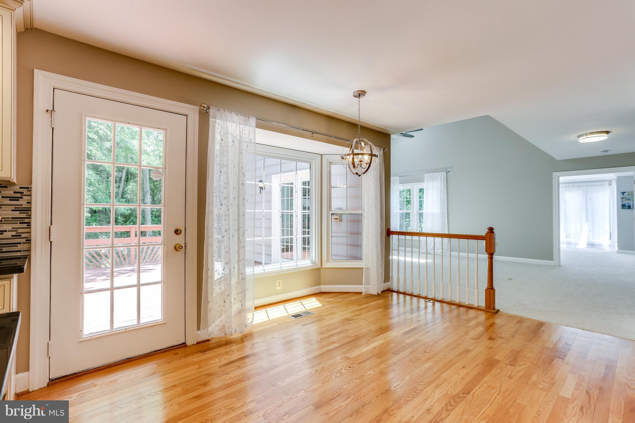 8394 Autumn Rust Road Ellicott City, MD 21043 - Photo 10 of 30 Breakfast area with bay windows overlooking trees.