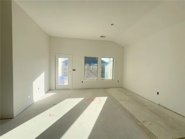 a living room with furniture and white walls